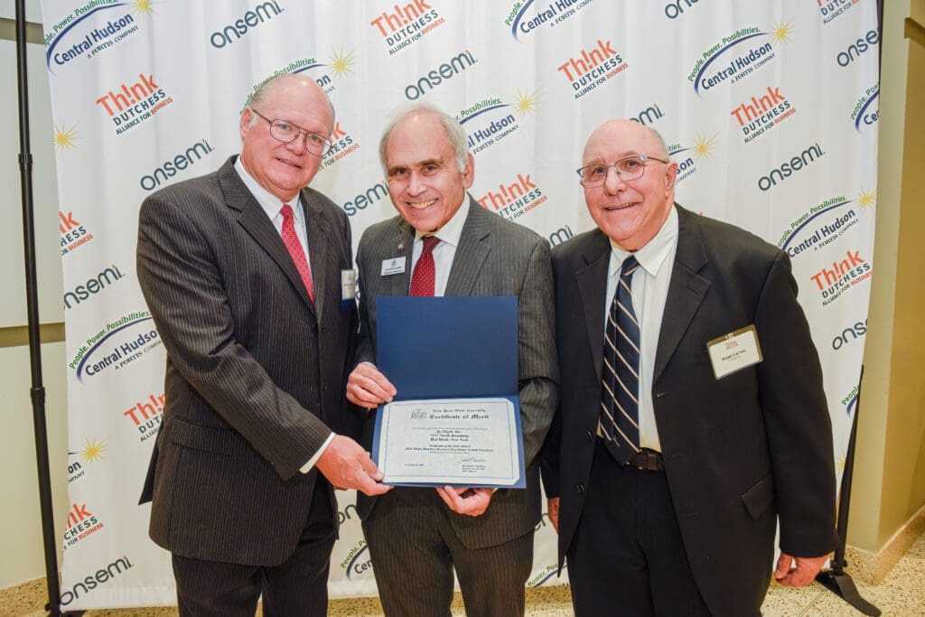 Nonprofit of the Year Award: Matthew G. Bateman, alongside the Honorable Jonathan G. Jacobson, and In Flight Board President Ralph LaCasio.