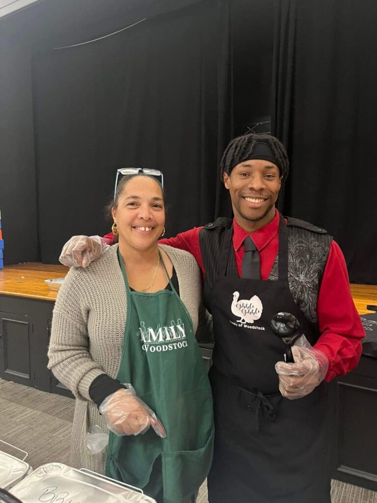 Ronda Broadhead (right) with an individual In Flight supports volunteering at the Family of Woodstock Thanksgiving Dinner