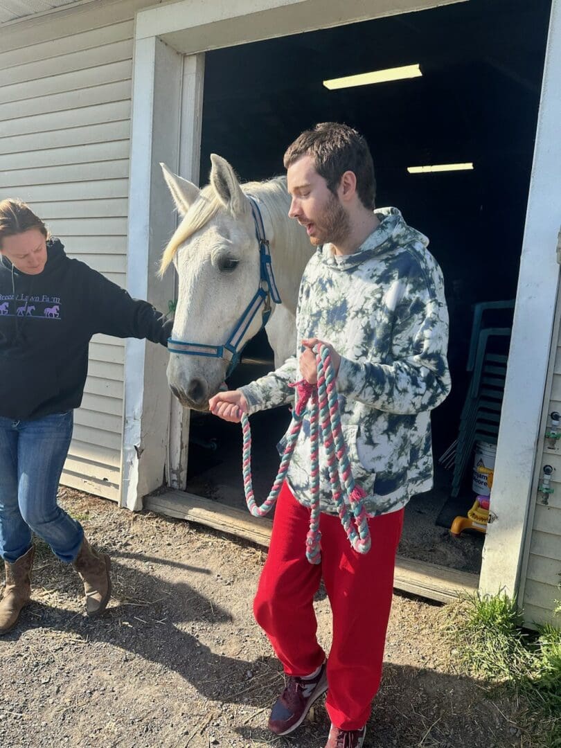 Build Hope by Becoming a Hope Builder for National Developmental Disabilities Awareness Month - Person we support experiencing equine therapy